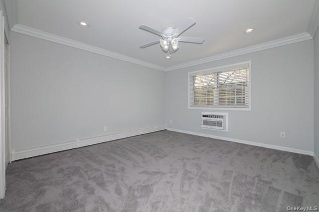 140 Sussex Place, Unit SH07 Bohemia, NY 11716 - Photo 10 of 11 an empty room with windows and fan