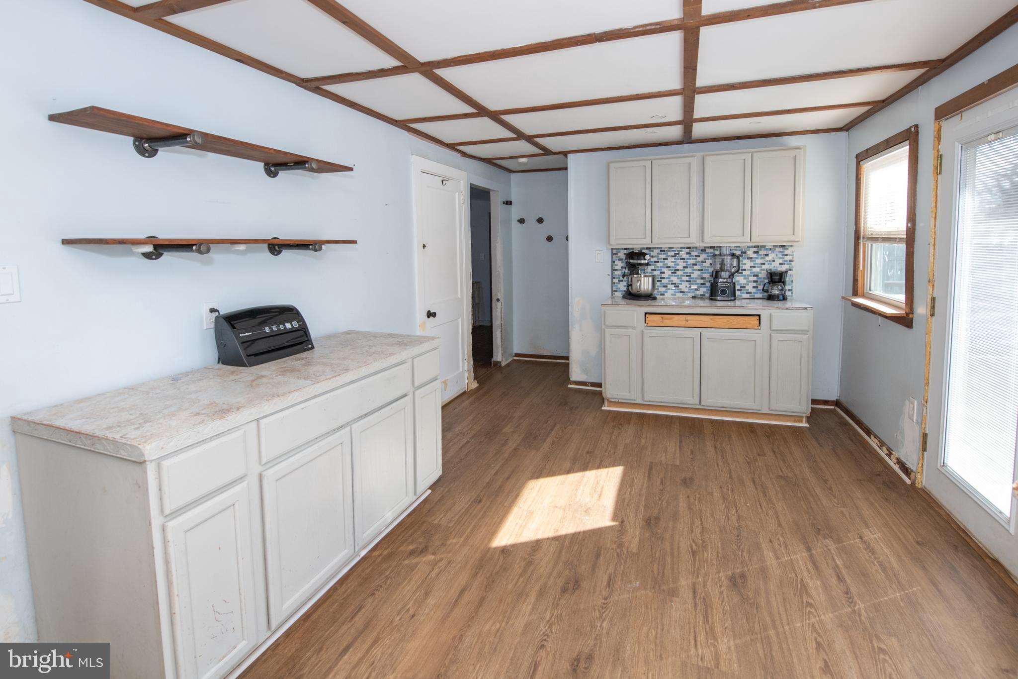 618 Cedar Avenue Croydon, PA 19021 - Photo 6 of 14 a kitchen with kitchen island a wooden floor and window