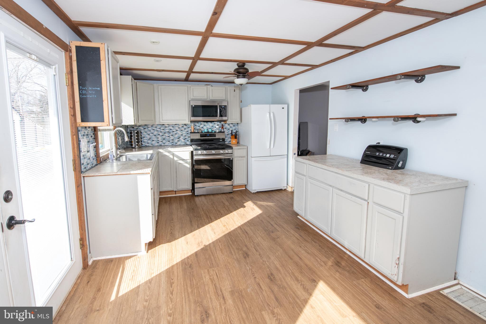 618 Cedar Avenue Croydon, PA 19021 - Photo 7 of 14 a kitchen with stainless steel appliances a stove a sink and a refrigerator