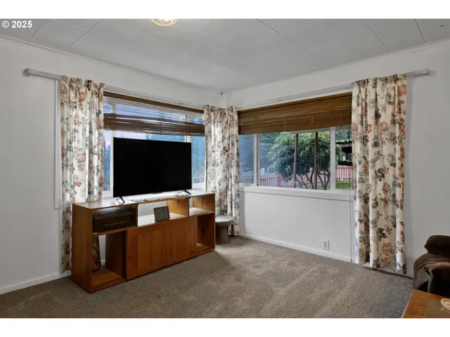 a kitchen with a table and chairs in it