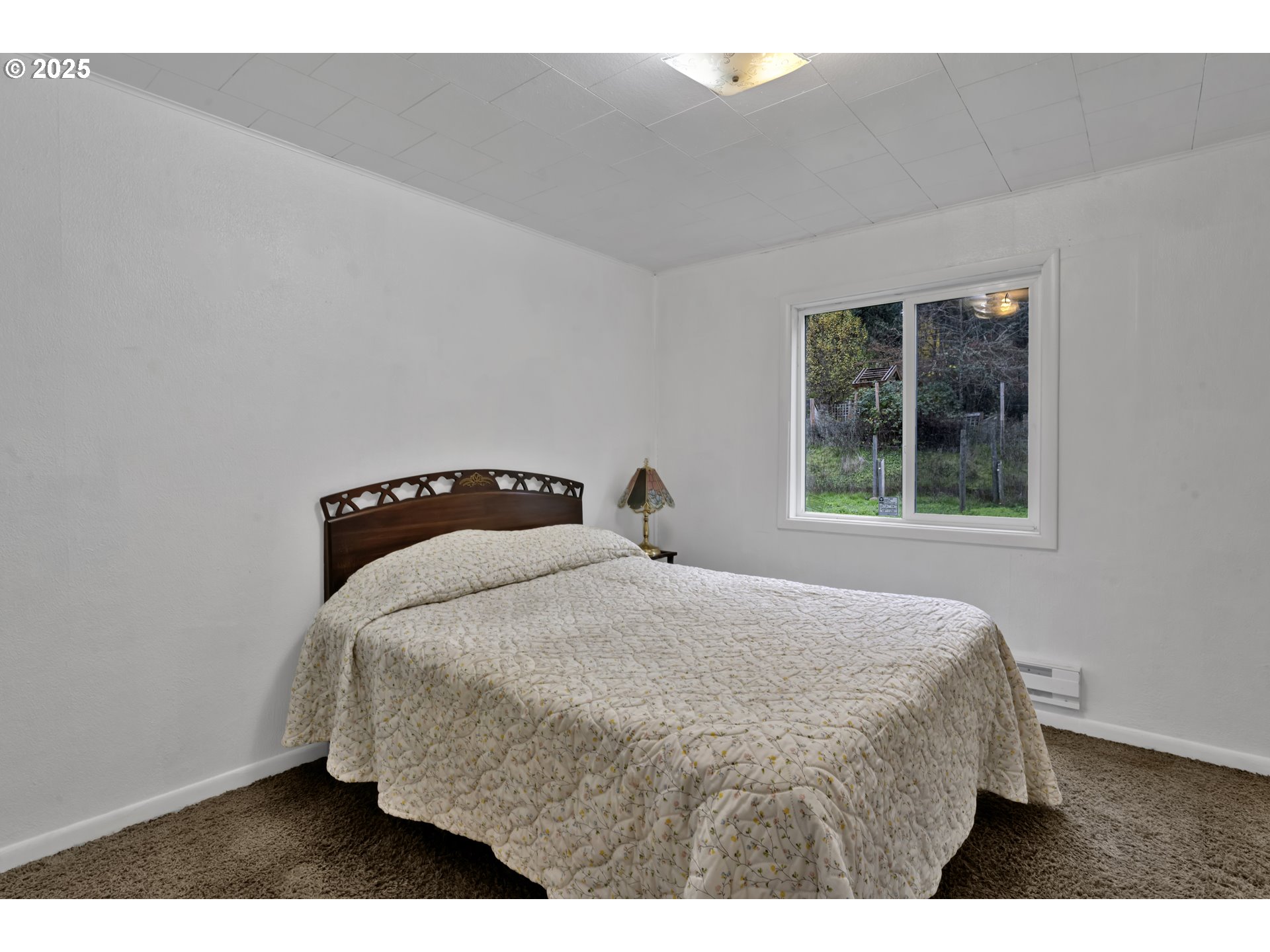 32253 Deberry Road Creswell, OR 97426 - Photo 27 of 43 a bedroom with a bed and a window