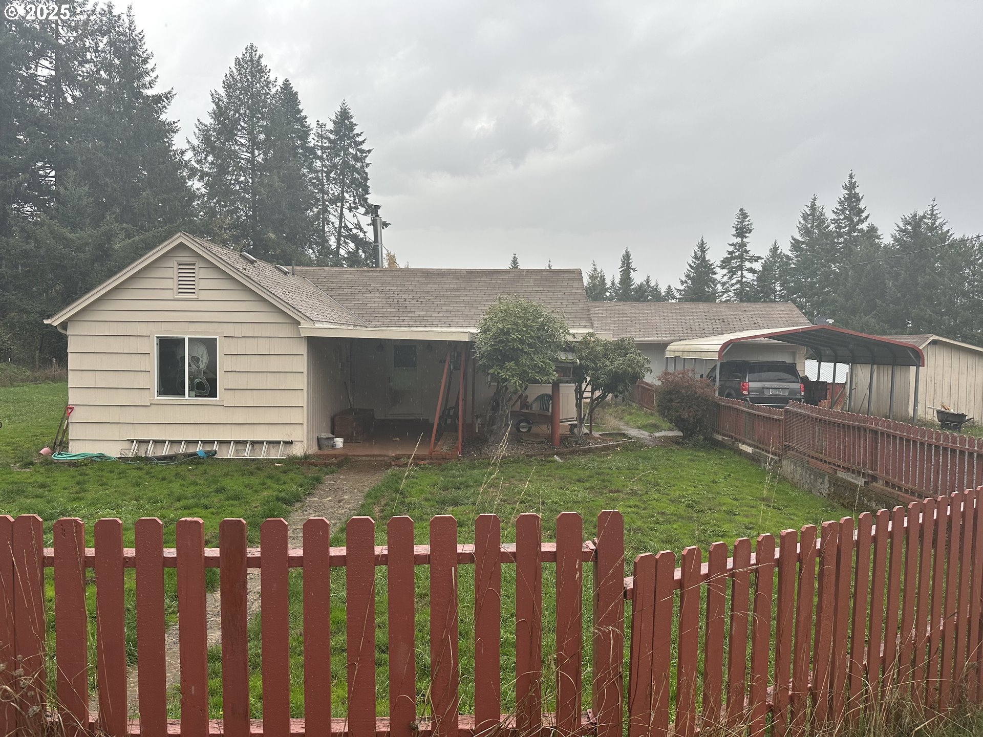 32253 Deberry Road Creswell, OR 97426 - Photo 4 of 43 a backyard of a house with table and chairs
