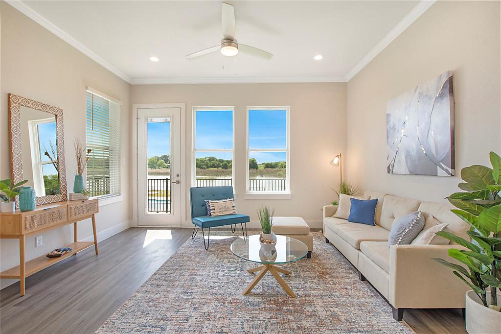 1319 West Main Street, Unit 18 Gun Barrel City, TX 75156 - Photo 1 of 1 Living area with wood finished floors, a ceiling fan, baseboards, and ornamental molding
