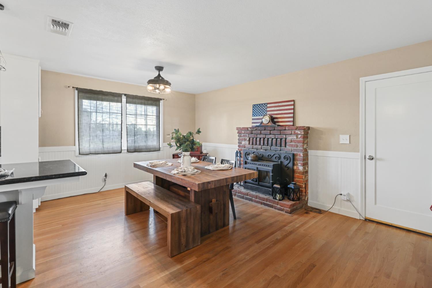 10691 Calvine Road Sacramento, CA 95830 - Photo 20 of 47 a view of a kitchen wooden floor and a living room