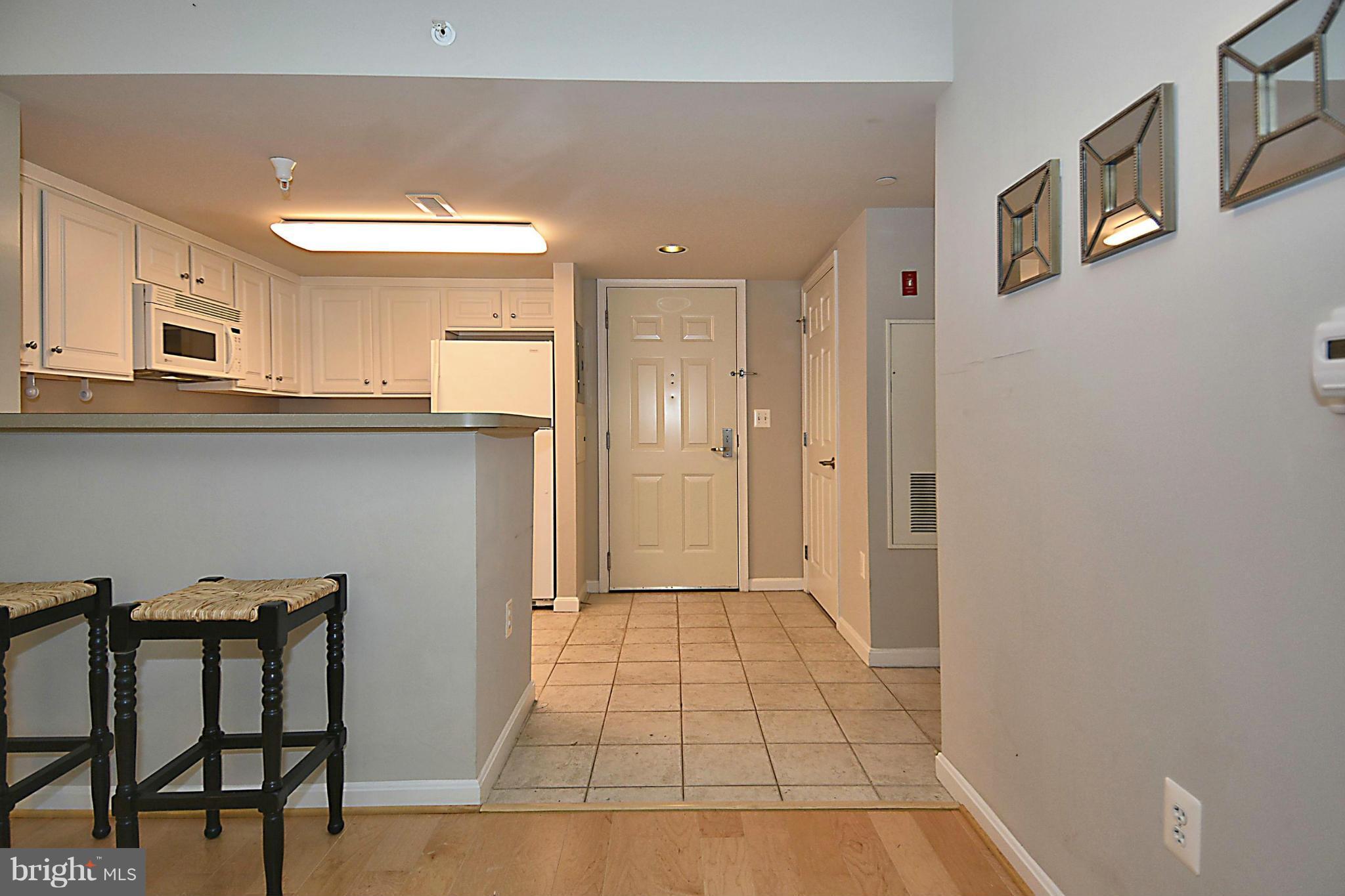 11710 Old Georgetown Road, Unit 419 North Bethesda, MD 20852 - Photo 10 of 30 a view of a livingroom with wooden floor and furniture