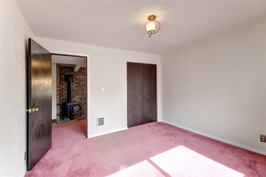 6830 Cady Road Everett, WA 98203 - Photo 22 of 28 a view of an empty room with closet and a bathroom