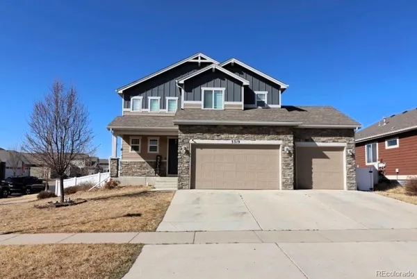 a front view of a house with yard