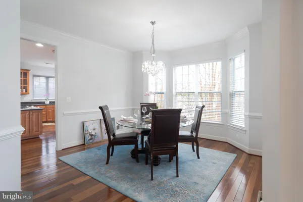 a kitchen with granite countertop a stove and a white cabinet