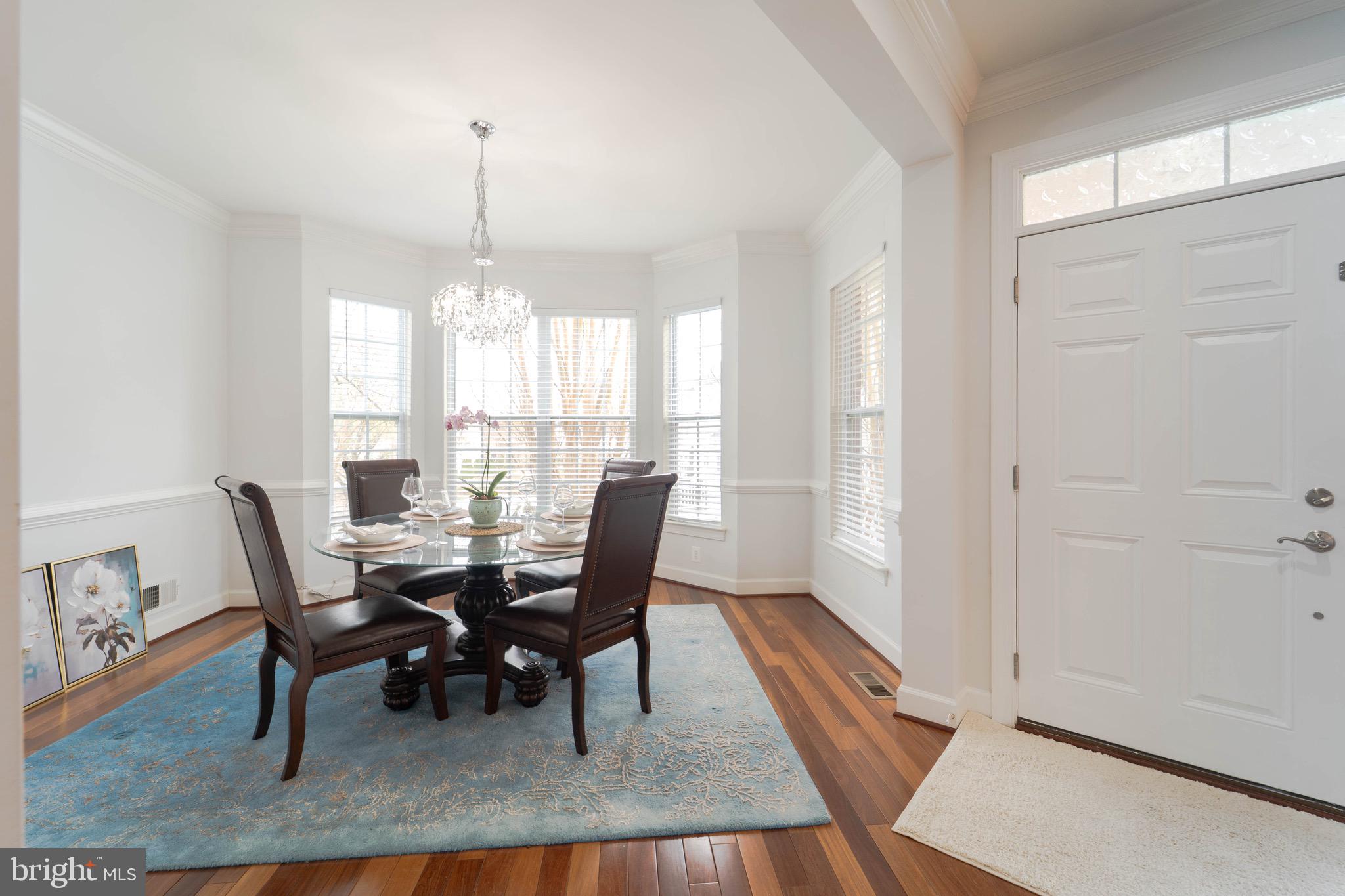 16309 Sandy Ridge Court Woodbridge, VA 22191 - Photo 14 of 93 a view of a dining room with furniture window and wooden floor