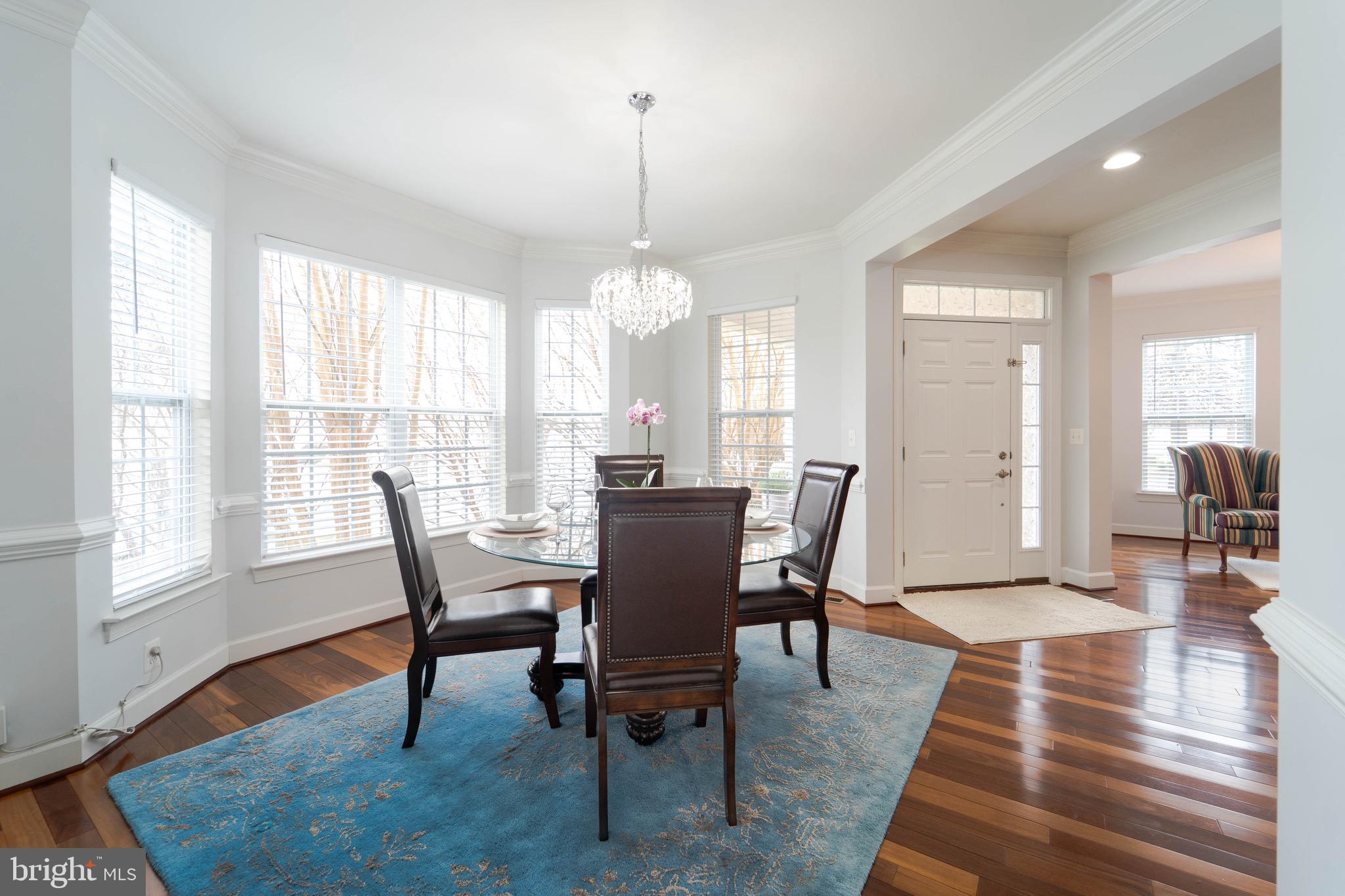 16309 Sandy Ridge Court Woodbridge, VA 22191 - Photo 16 of 93 a view of a dining room with furniture window and wooden floor