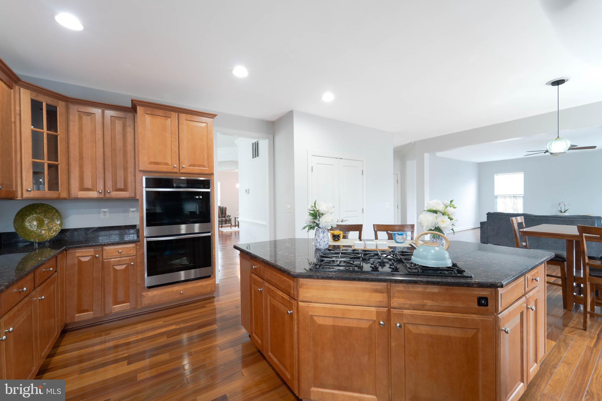 16309 Sandy Ridge Court Woodbridge, VA 22191 - Photo 26 of 93 a kitchen with stainless steel appliances granite countertop a stove a sink and a refrigerator