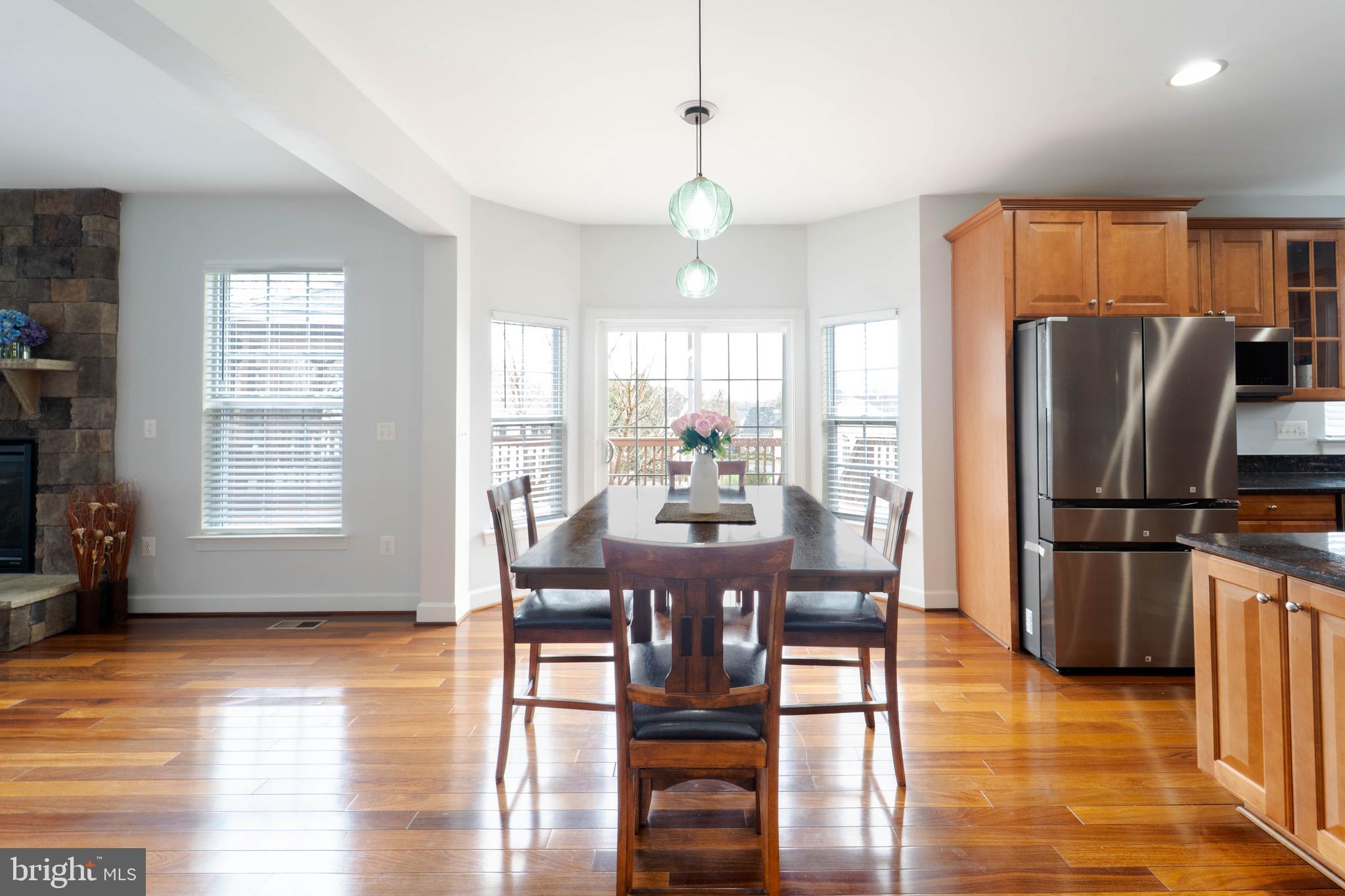 16309 Sandy Ridge Court Woodbridge, VA 22191 - Photo 29 of 93 a view of a dining room with furniture window and wooden floor