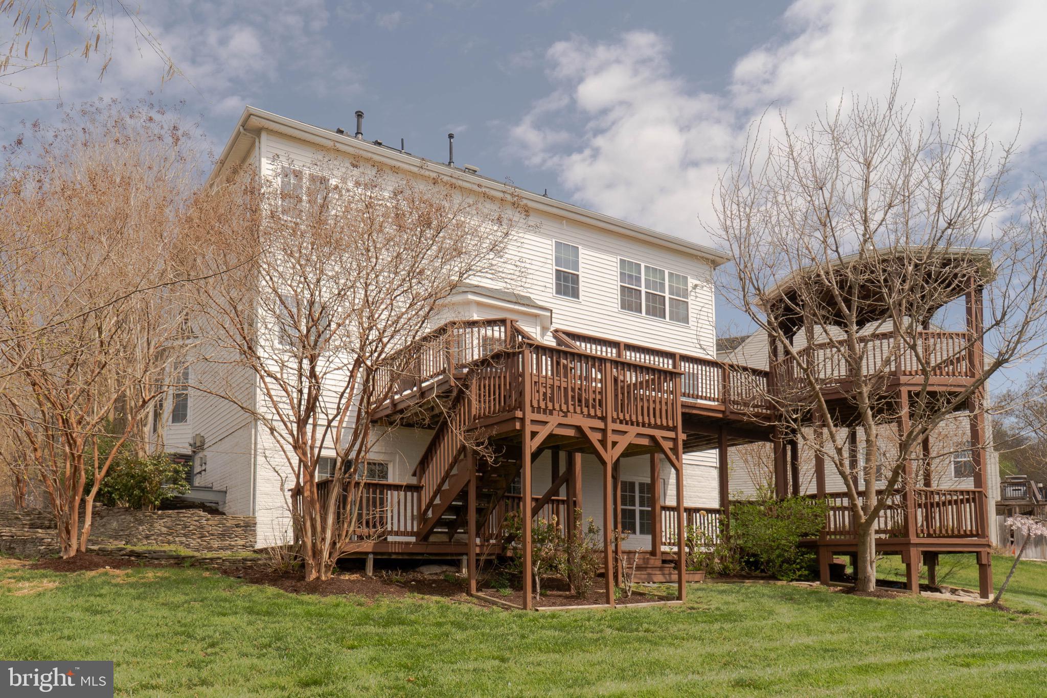 16309 Sandy Ridge Court Woodbridge, VA 22191 - Photo 3 of 93 a front view of a house with a yard