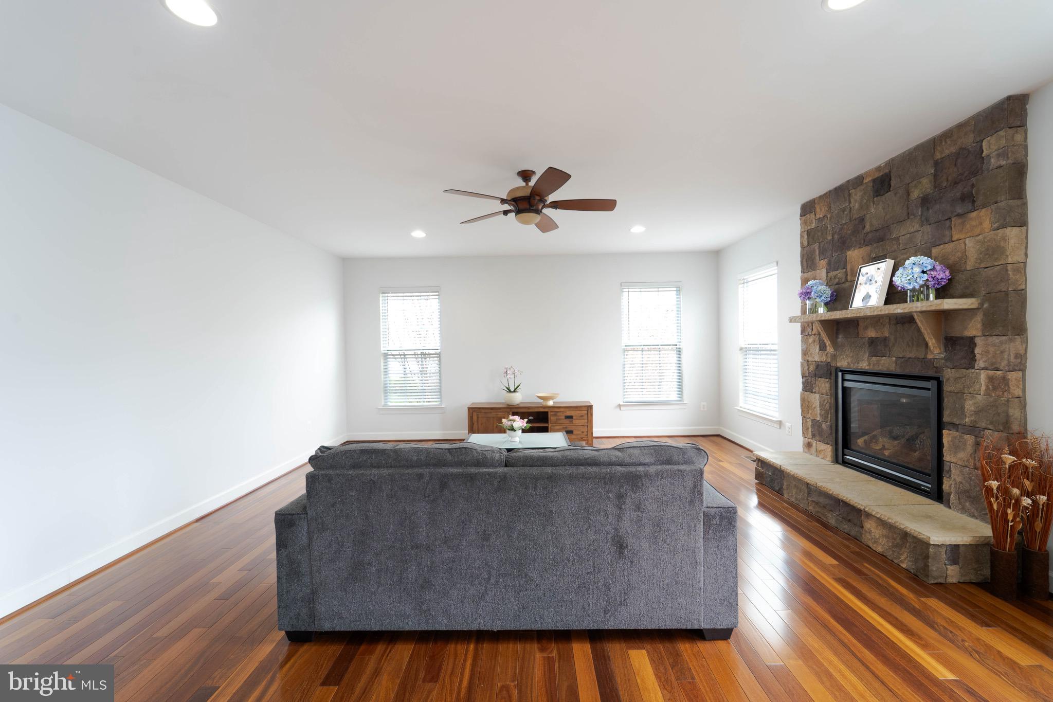 16309 Sandy Ridge Court Woodbridge, VA 22191 - Photo 31 of 93 a living room with furniture and a fireplace