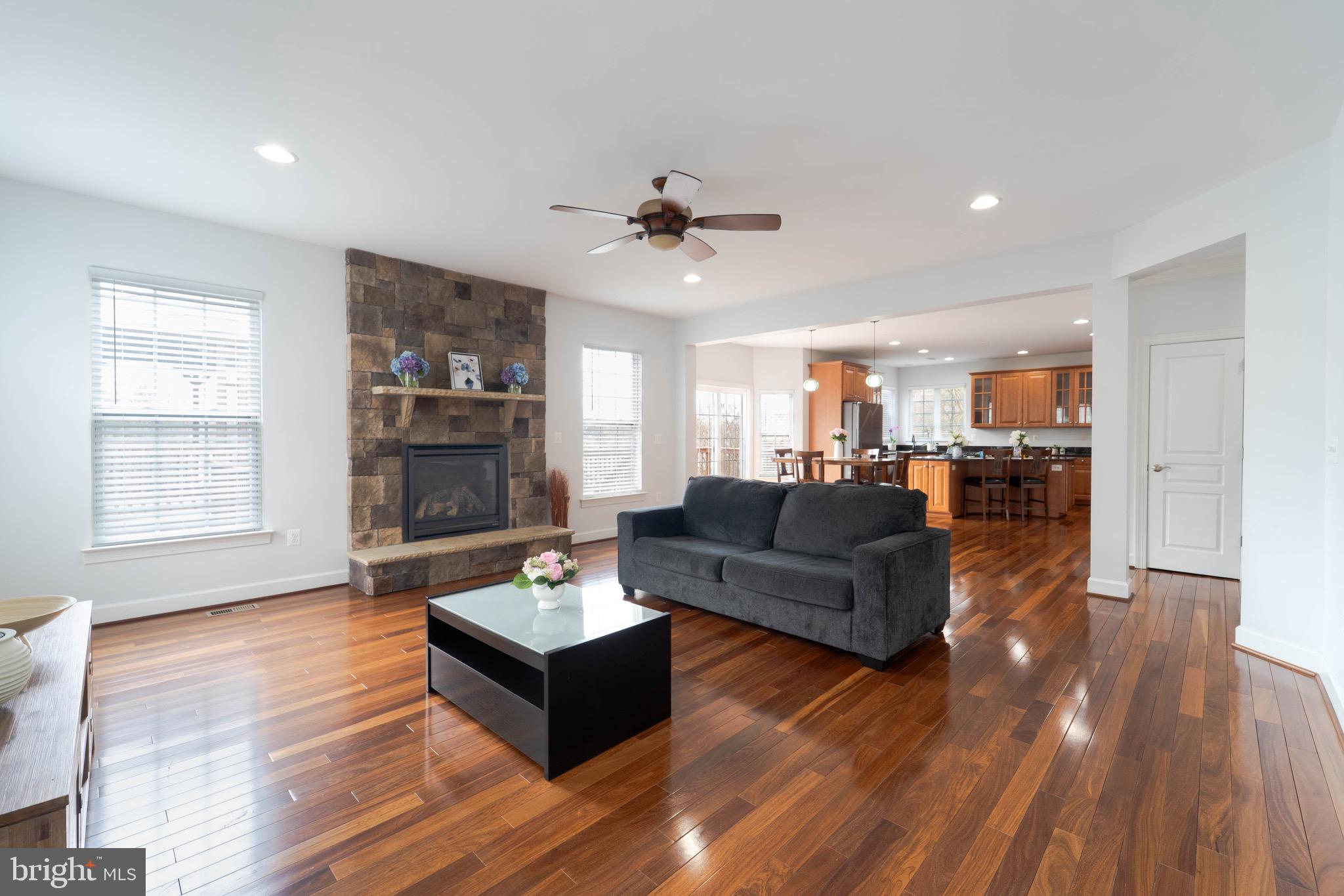 16309 Sandy Ridge Court Woodbridge, VA 22191 - Photo 33 of 93 a living room with furniture and a wooden floor