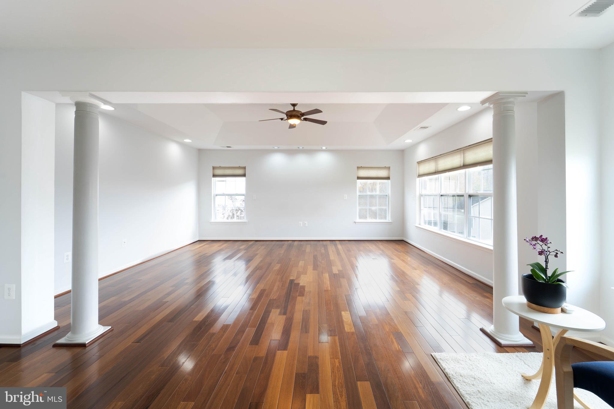 16309 Sandy Ridge Court Woodbridge, VA 22191 - Photo 38 of 93 a view of an empty room with wooden floor and a window