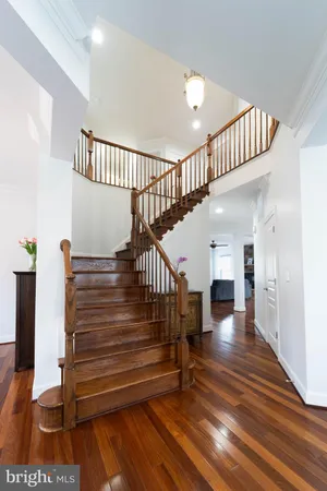 a living room with furniture a wooden floor and a window