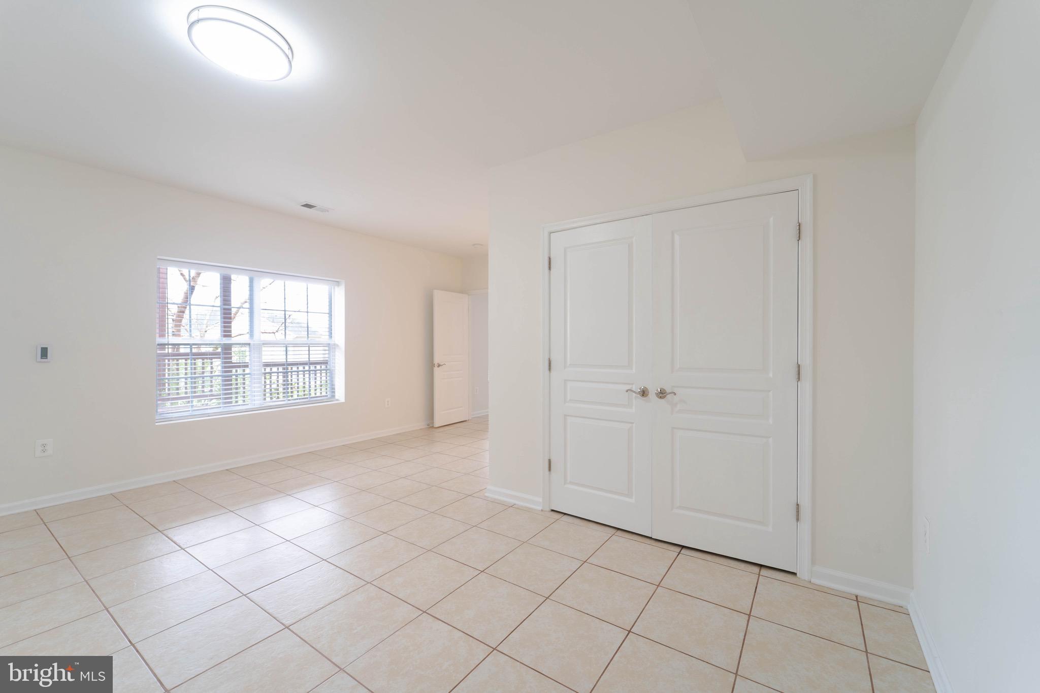 16309 Sandy Ridge Court Woodbridge, VA 22191 - Photo 66 of 93 a view of an empty room with window and cabinet area