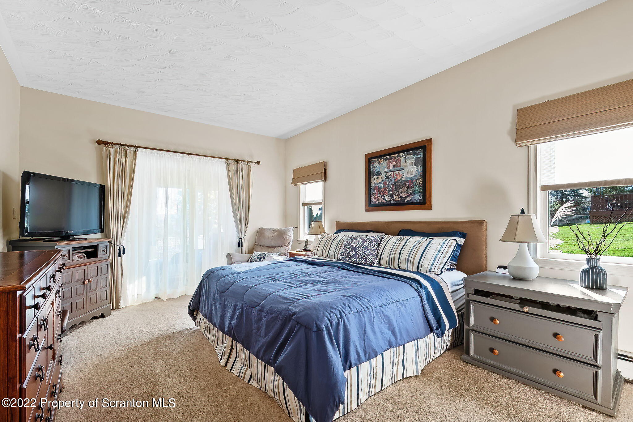 131 Ridgeview Drive Scranton, PA 18504 - Photo 23 of 32 a bedroom with a bed and a flat screen tv