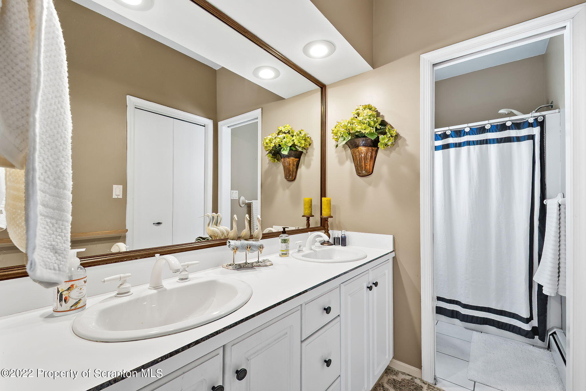 131 Ridgeview Drive Scranton, PA 18504 - Photo 25 of 32 a bathroom with a double vanity sink and a mirror