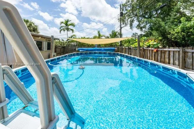 a view of balcony with wooden floor and outdoor seating