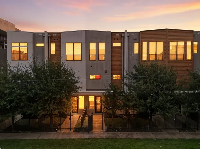 a front view of building with a garden