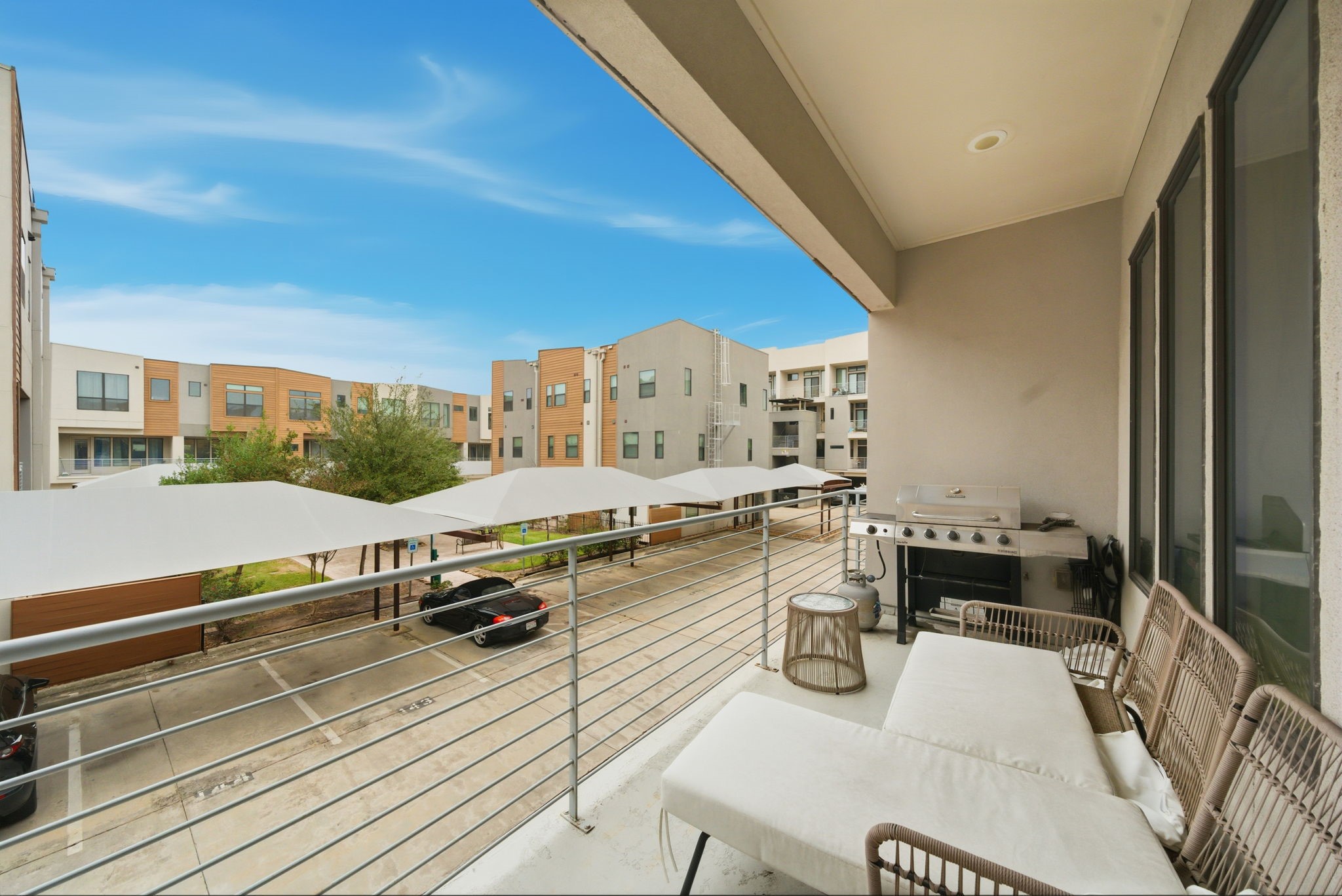2401 Crawford Street, Unit C1C Houston, TX 77004 - Photo 12 of 24 a view of a balcony with chairs