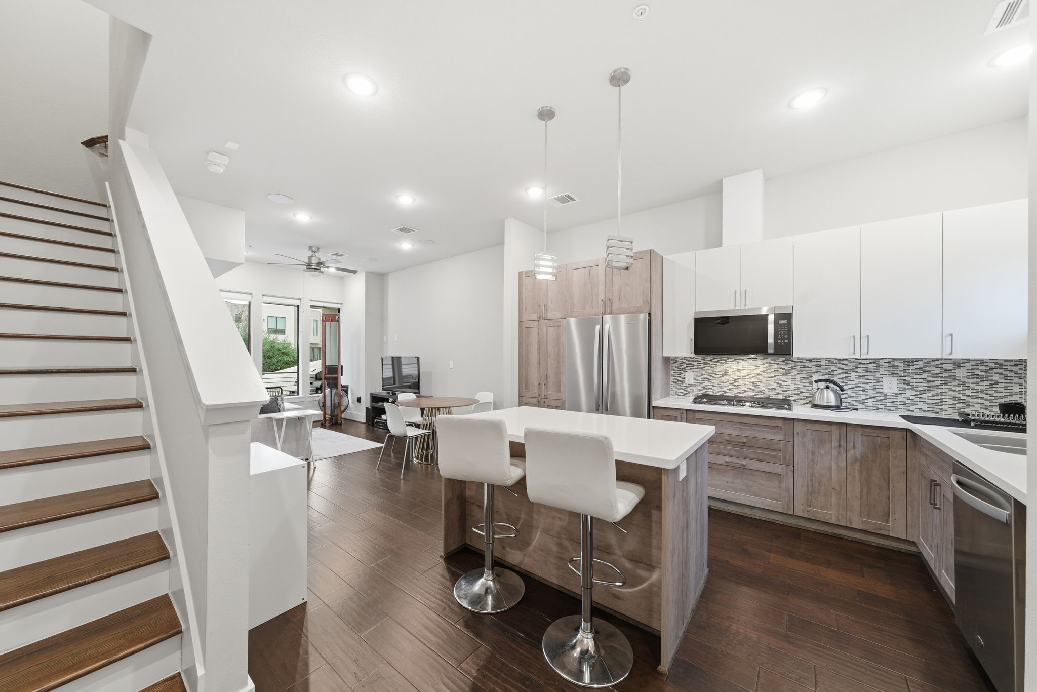 2401 Crawford Street, Unit C1C Houston, TX 77004 - Photo 14 of 24 a large kitchen with a table and chairs