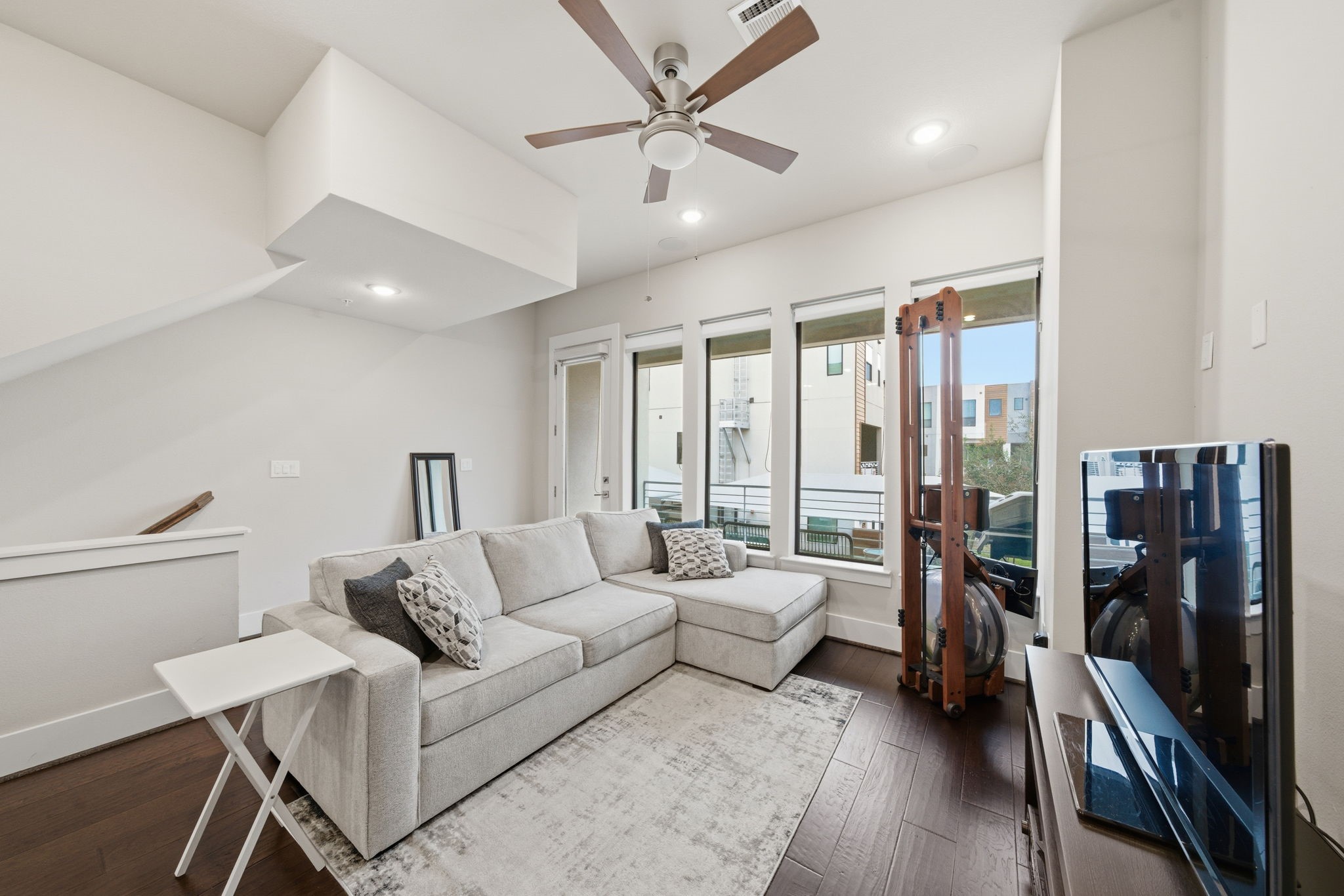 2401 Crawford Street, Unit C1C Houston, TX 77004 - Photo 7 of 24 a living room with furniture and a large window
