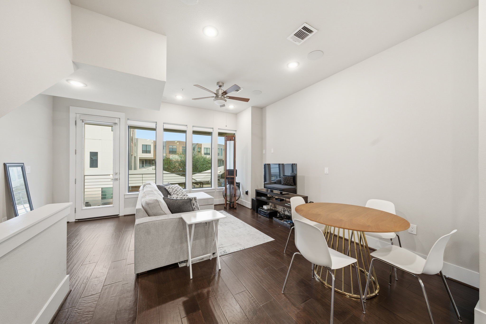 2401 Crawford Street, Unit C1C Houston, TX 77004 - Photo 8 of 24 a living room with furniture and a large window