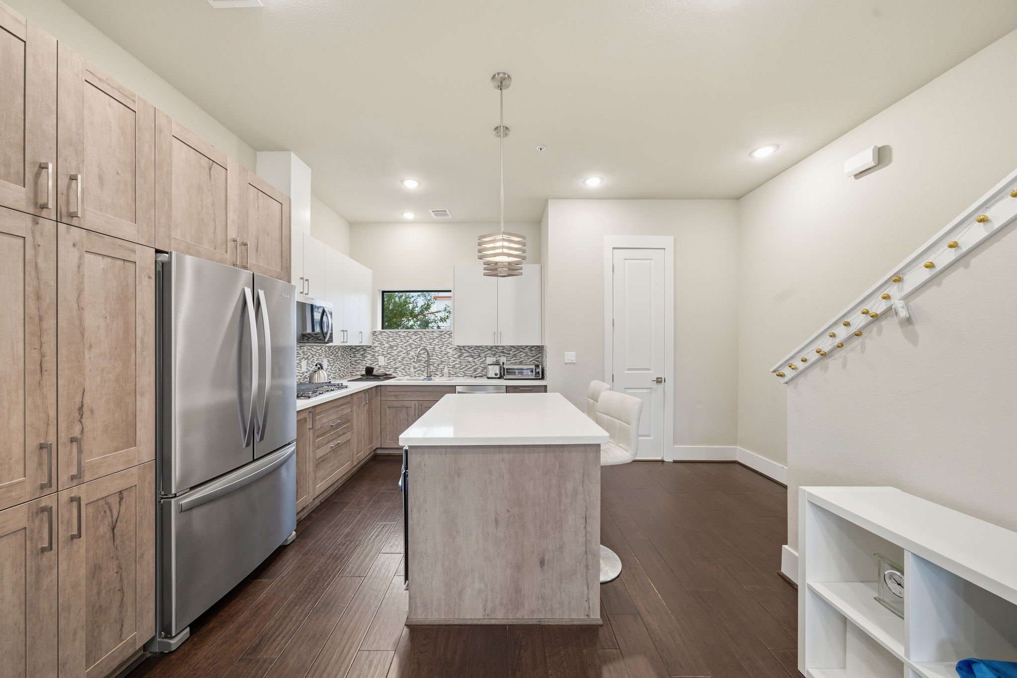 2401 Crawford Street, Unit C1C Houston, TX 77004 - Photo 9 of 24 a kitchen with kitchen island a sink appliances and cabinets