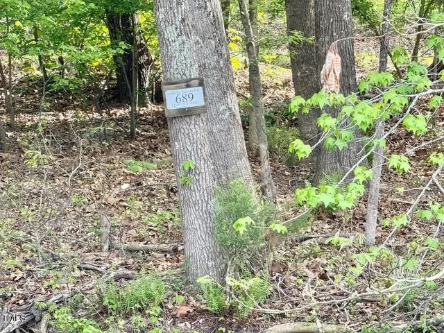 a view of a lake from a balcony with outdoor space