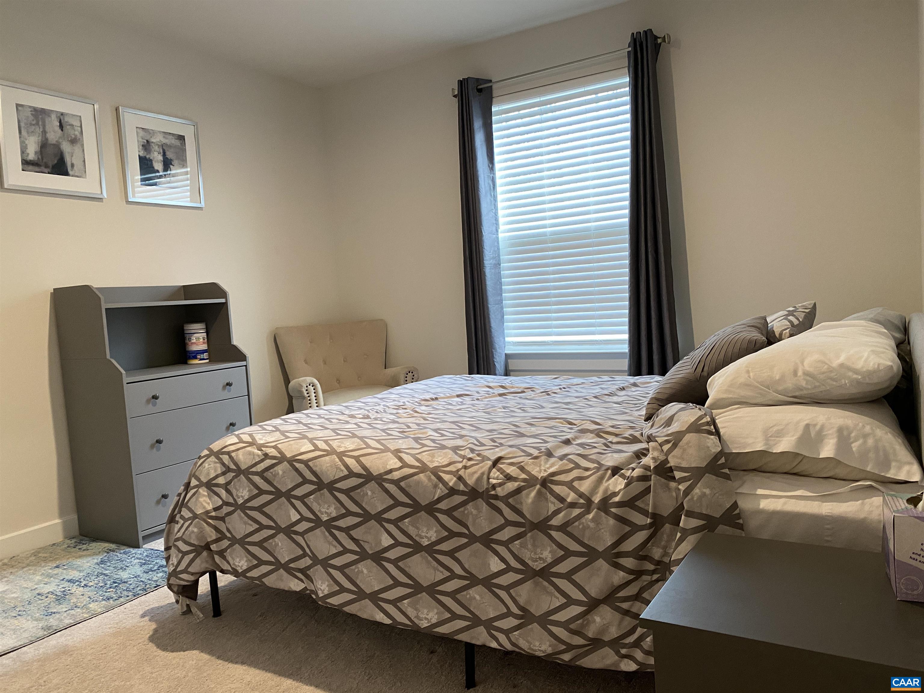 3402 Steamer Drive Keswick, VA 22947 - Photo 18 of 27 a bedroom with a bed and a desk