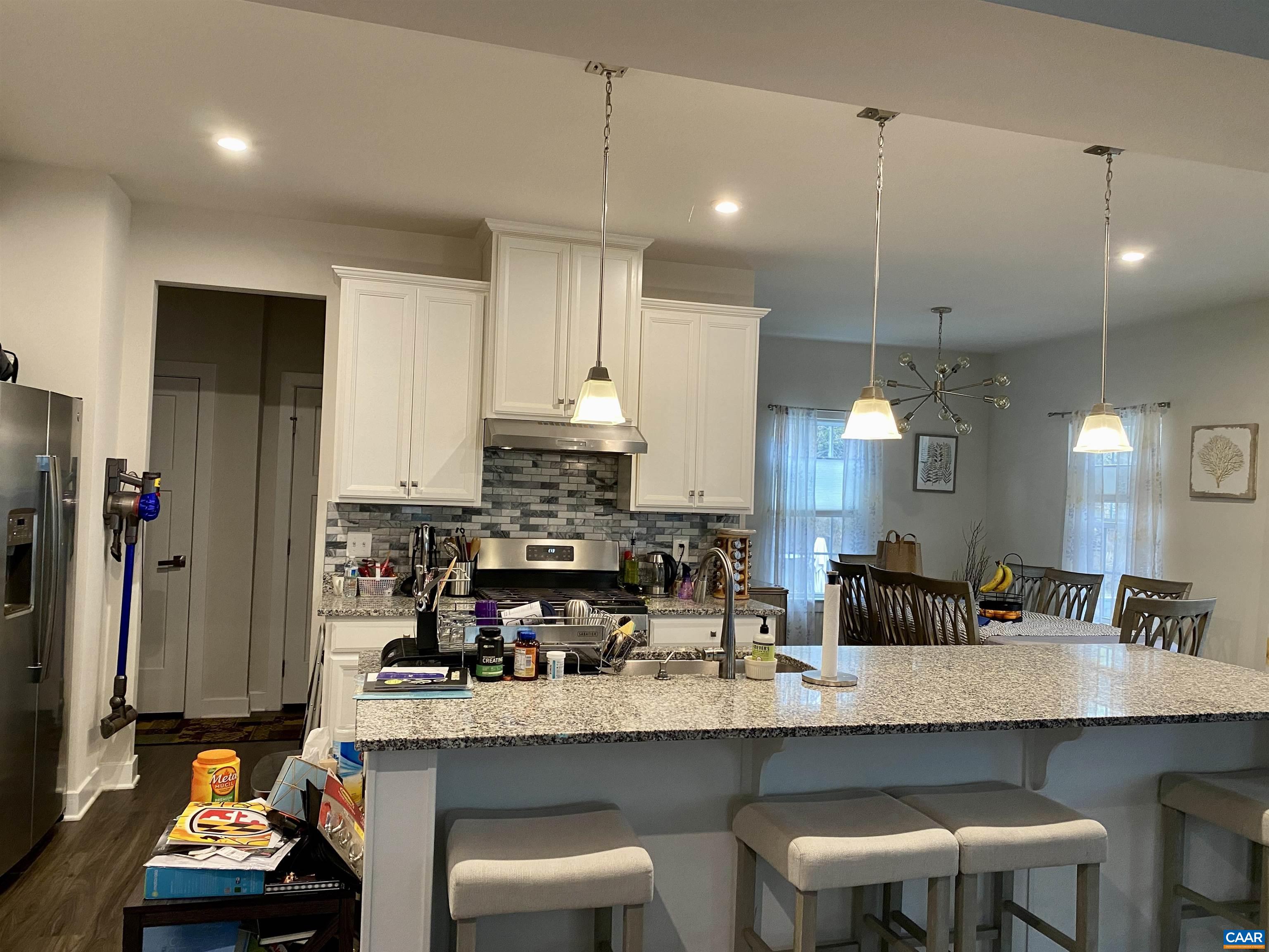 3402 Steamer Drive Keswick, VA 22947 - Photo 7 of 27 a kitchen with stainless steel appliances granite countertop a sink and cabinets