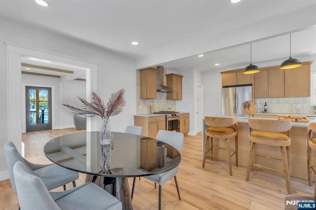 12 Enfield Avenue Montclair, NJ 07042 - Photo 14 of 50 a view of a dining room with furniture and wooden floor