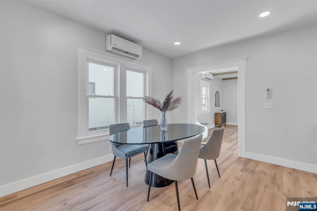 12 Enfield Avenue Montclair, NJ 07042 - Photo 15 of 50 a view of a dining room with furniture and wooden floor