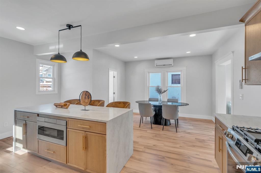 12 Enfield Avenue Montclair, NJ 07042 - Photo 20 of 50 a kitchen with a table chairs and a window