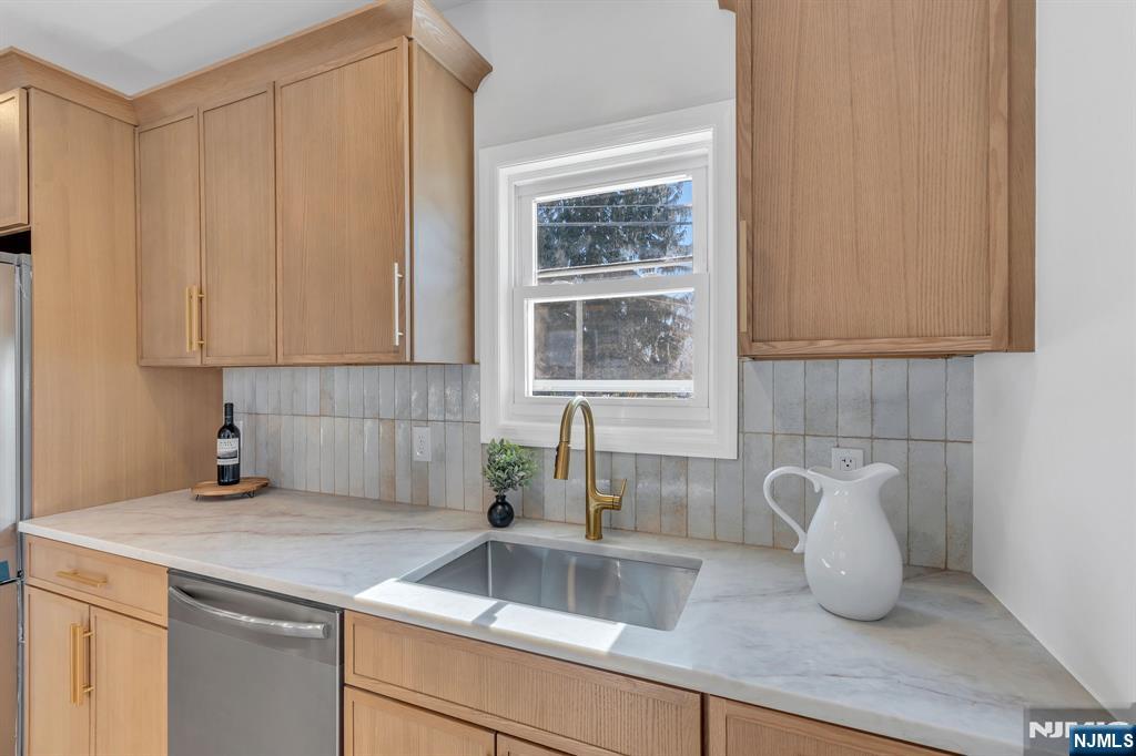 12 Enfield Avenue Montclair, NJ 07042 - Photo 21 of 50 a kitchen with a sink and cabinets