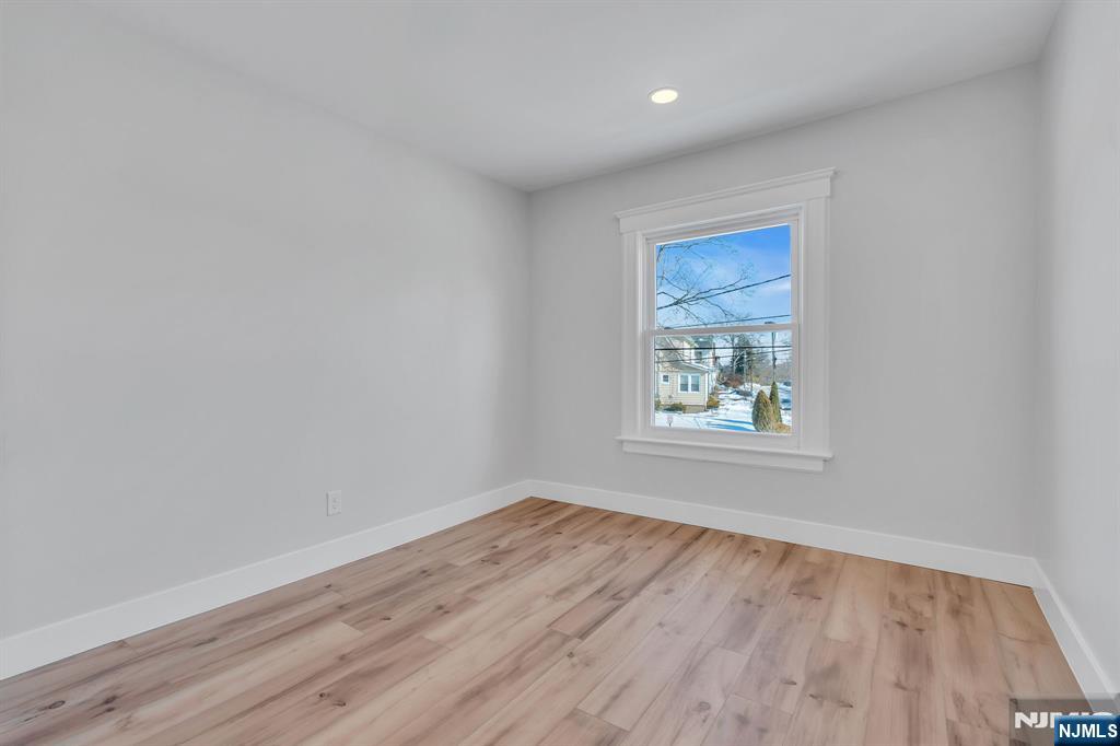 12 Enfield Avenue Montclair, NJ 07042 - Photo 24 of 50 wooden floor in an empty room with a window
