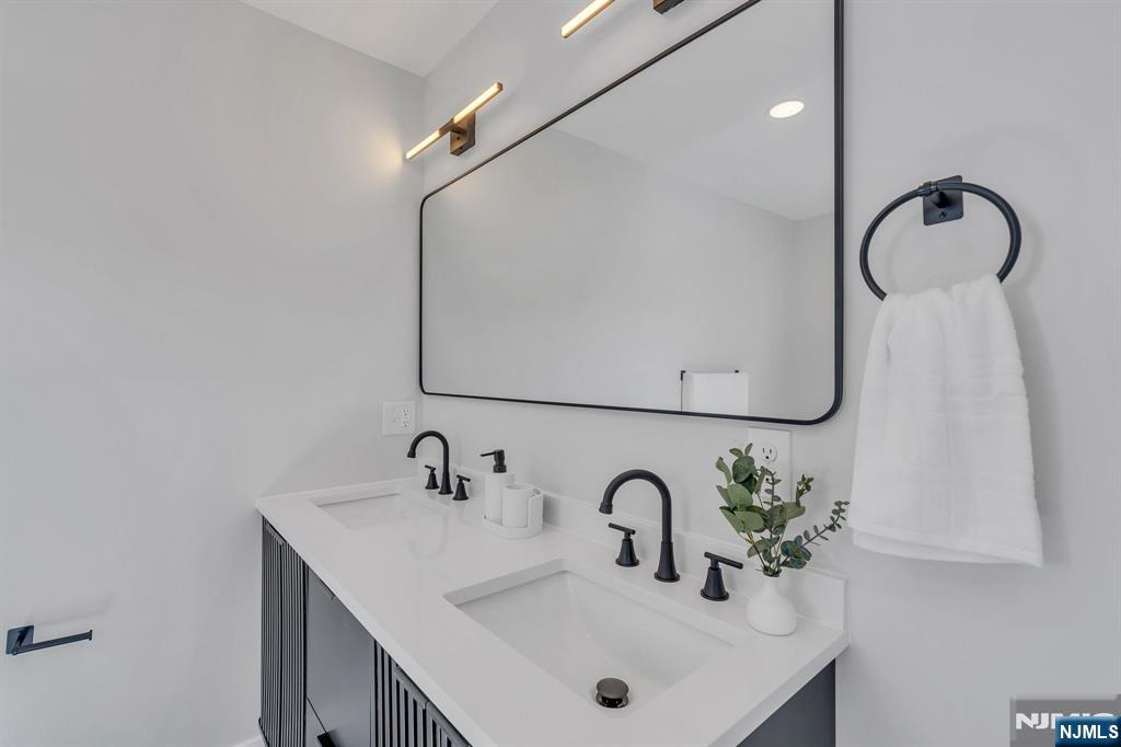 12 Enfield Avenue Montclair, NJ 07042 - Photo 27 of 50 a bathroom with a sink and a mirror