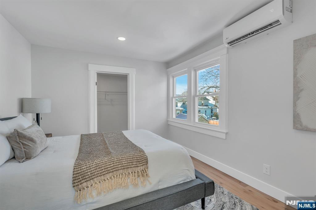 12 Enfield Avenue Montclair, NJ 07042 - Photo 29 of 50 a bedroom with a bed and a window
