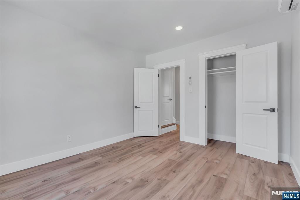 12 Enfield Avenue Montclair, NJ 07042 - Photo 34 of 50 a view of an empty room and wooden floor