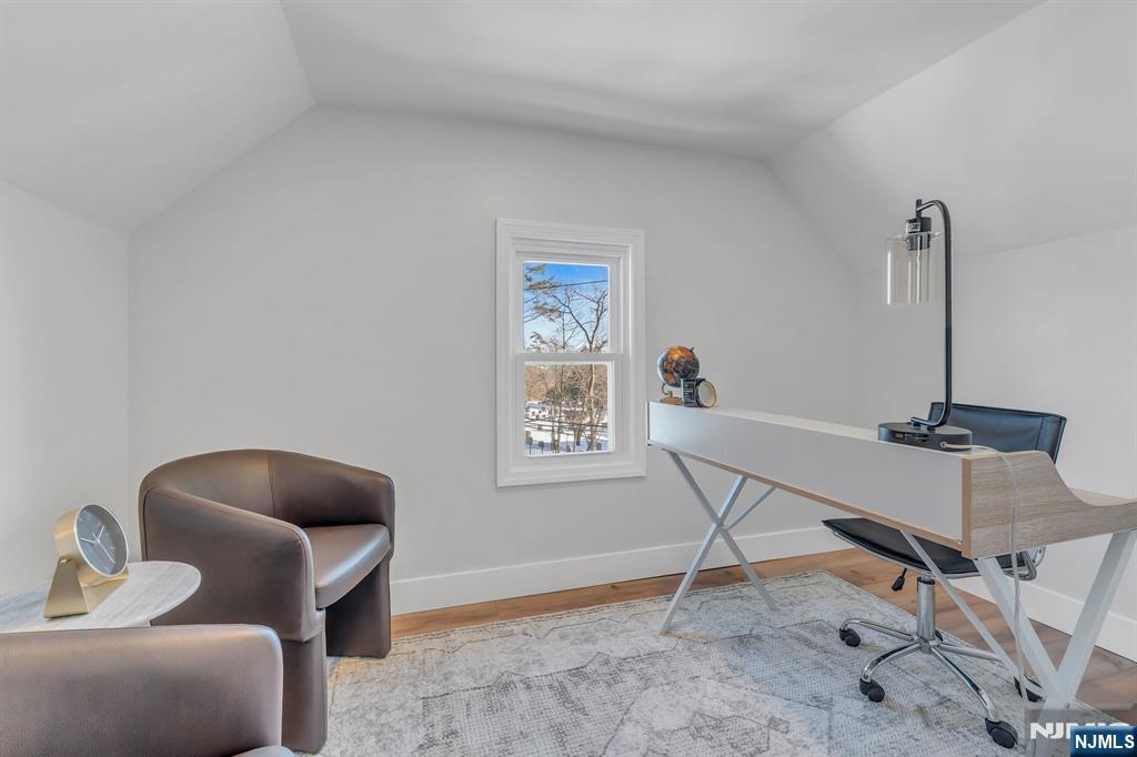 12 Enfield Avenue Montclair, NJ 07042 - Photo 42 of 50 a living room with furniture and a window