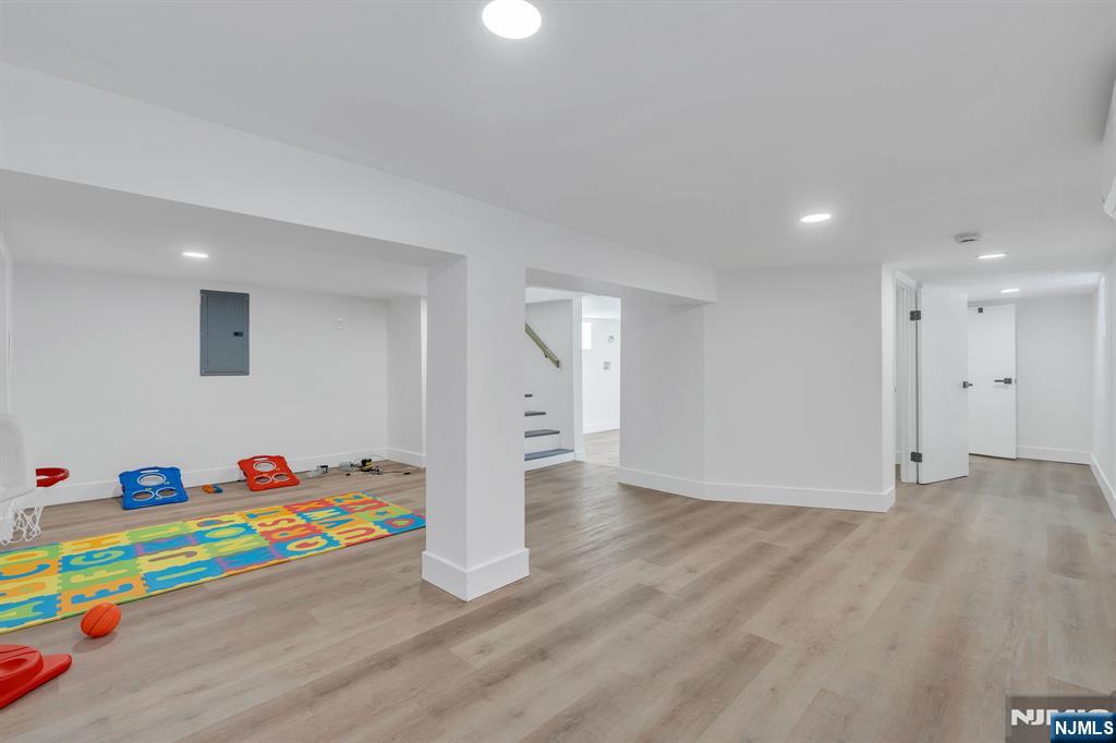 12 Enfield Avenue Montclair, NJ 07042 - Photo 46 of 50 a room with furniture and a wooden floor