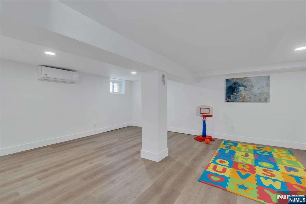 12 Enfield Avenue Montclair, NJ 07042 - Photo 47 of 50 a room with wooden floor and pool table