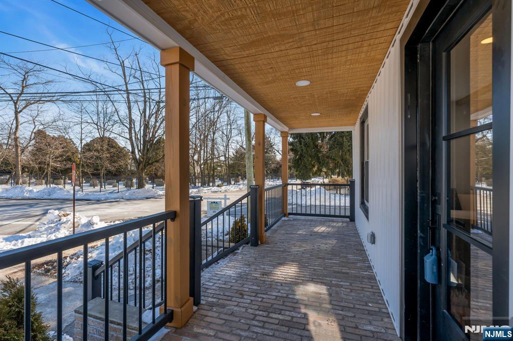 12 Enfield Avenue Montclair, NJ 07042 - Photo 5 of 50 a view of a porch with wooden floor and stairs