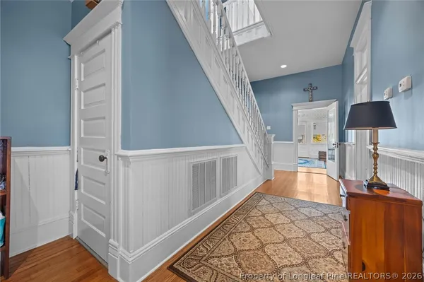 a view of a hallway view with staircase