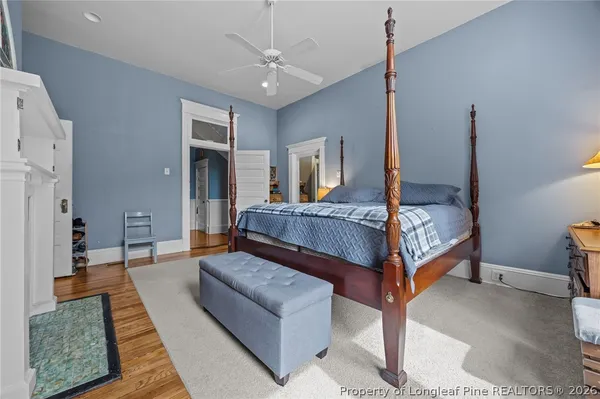 a bedroom with a bed window and walk in closet