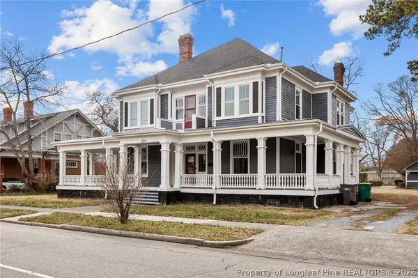 a view of a large building with a small yard