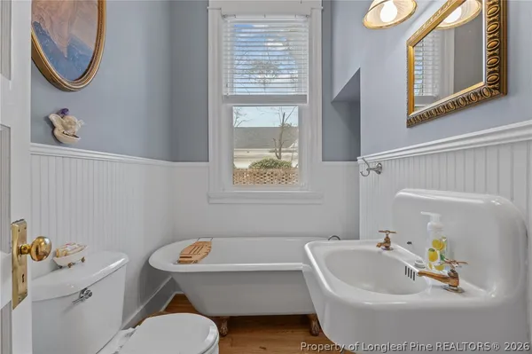 a bathroom with a sink a toilet and a bathtub